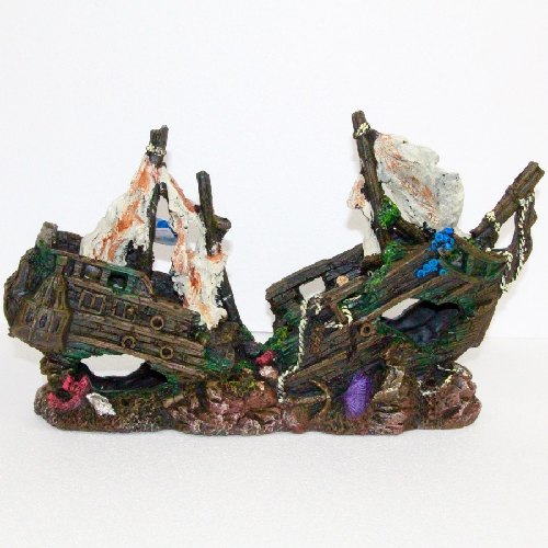 Aquarium decoration of a sunken pirate shipwreck with rocks and colorful details